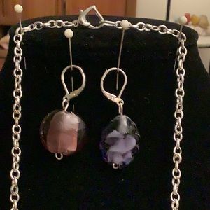 A variety of lamp work glass beads.All one of a kind. Earrings are purple.